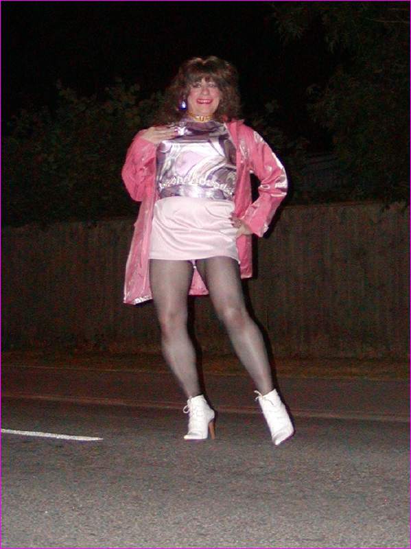 Denise : Your Favourite TV Super-Model - Well its really cold in my lingerie, so I've put on my pink Berketex Coat - Out in the MIDDLE of the ROAD - Now they MUST see me - Wow....I can hear a cruising car - Maybe this is my lucky night!